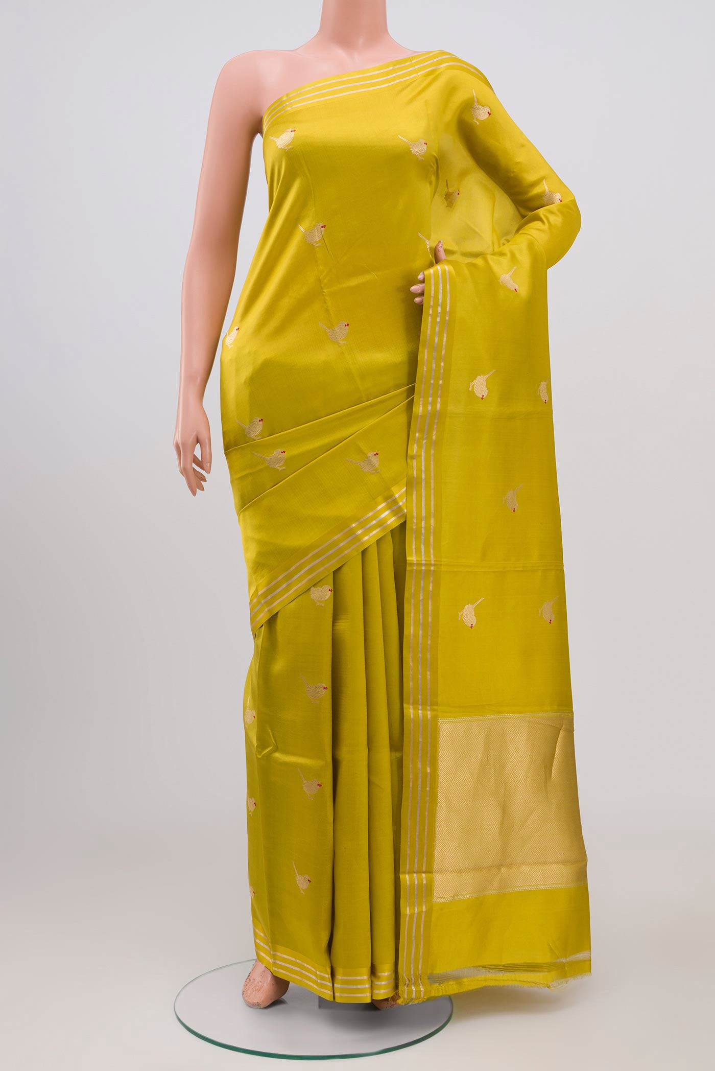 Lemon Yellow Raw Silk Saree with Zari Butta on the body and Thin Zari Line.  displayed on a mannequin