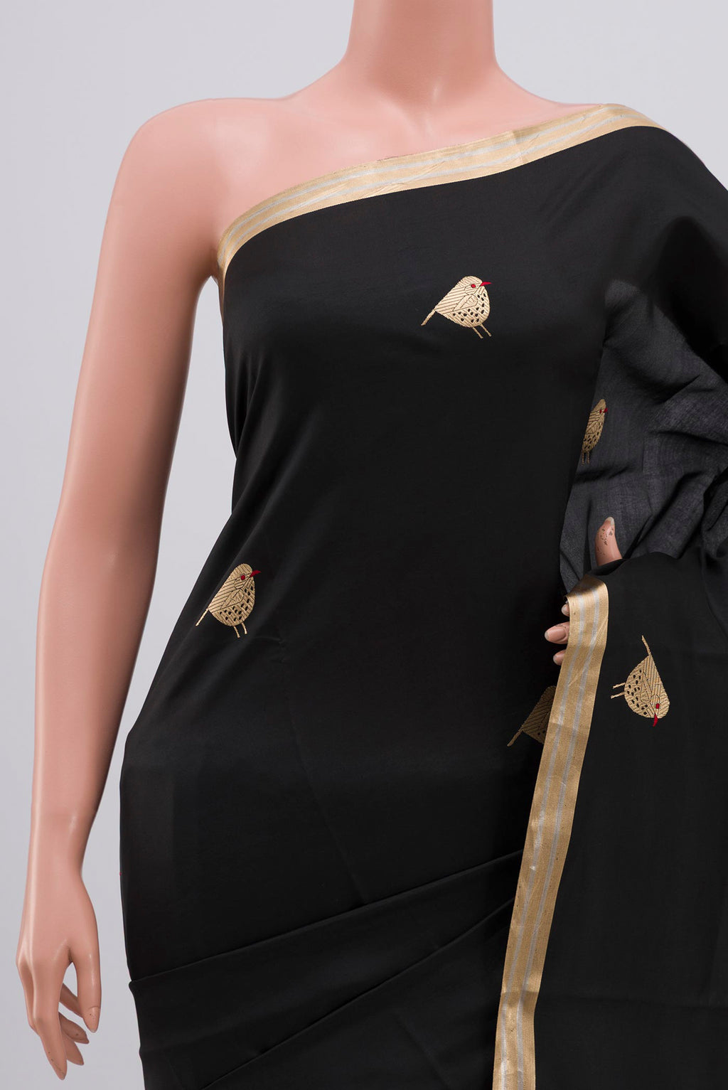 Border image of Black Raw Silk Saree with Zari Butta on the body and Zari Border. 