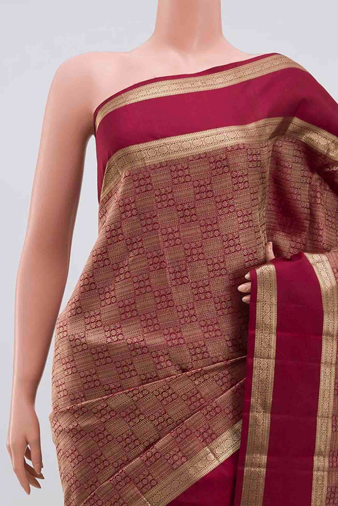 Border image of Maroon Kanchipuram Silk Saree with Zari Brocade on the body and Zari Border. 