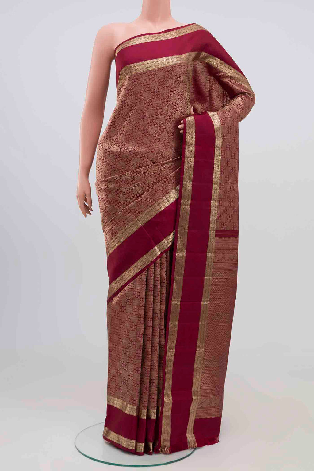 Maroon Kanchipuram Silk Saree with Zari Brocade on the body and Zari Border.  displayed on a mannequin