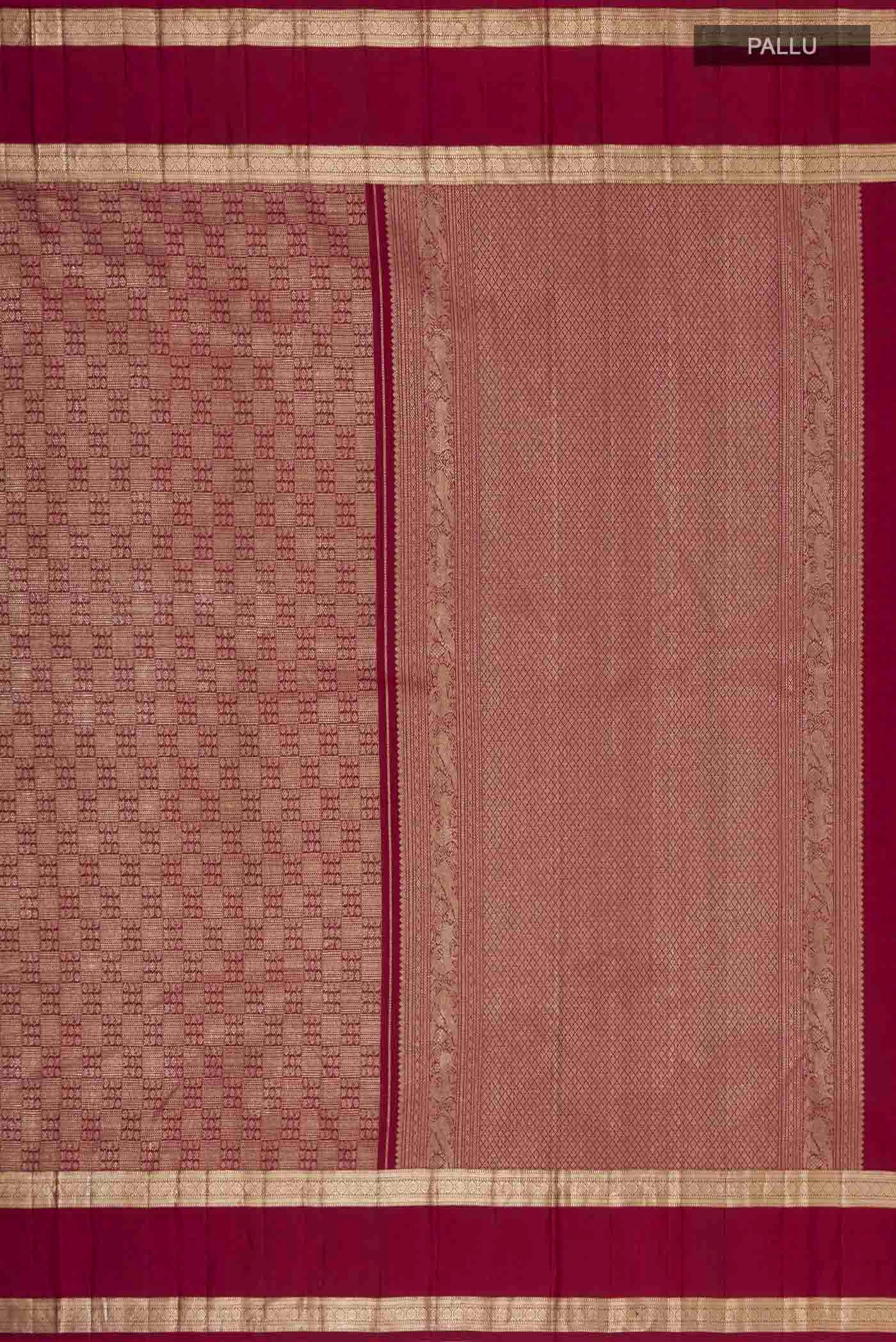 Close up image of the pallu of Maroon Kanchipuram Silk Saree with Zari Brocade on the body and Zari Border. 