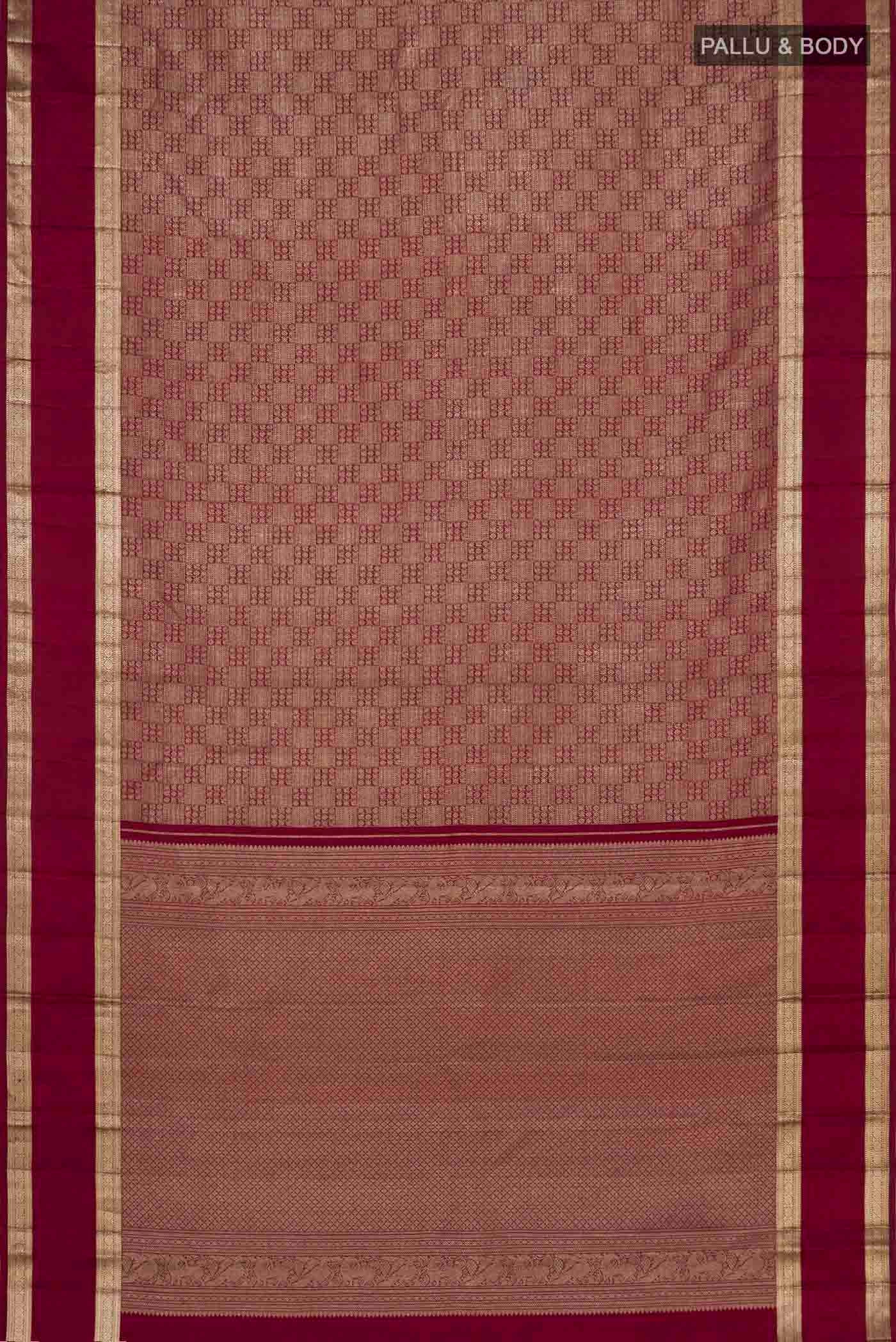 Flat view of Maroon Kanchipuram Silk Saree with Zari Brocade on the body and Zari Border. 