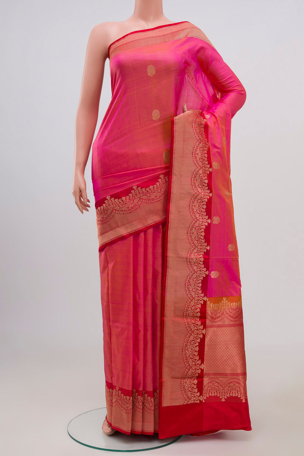 Pink Banarasi Katan Silk Saree with Zari Butta on the body and Zari Border.  displayed on a mannequin