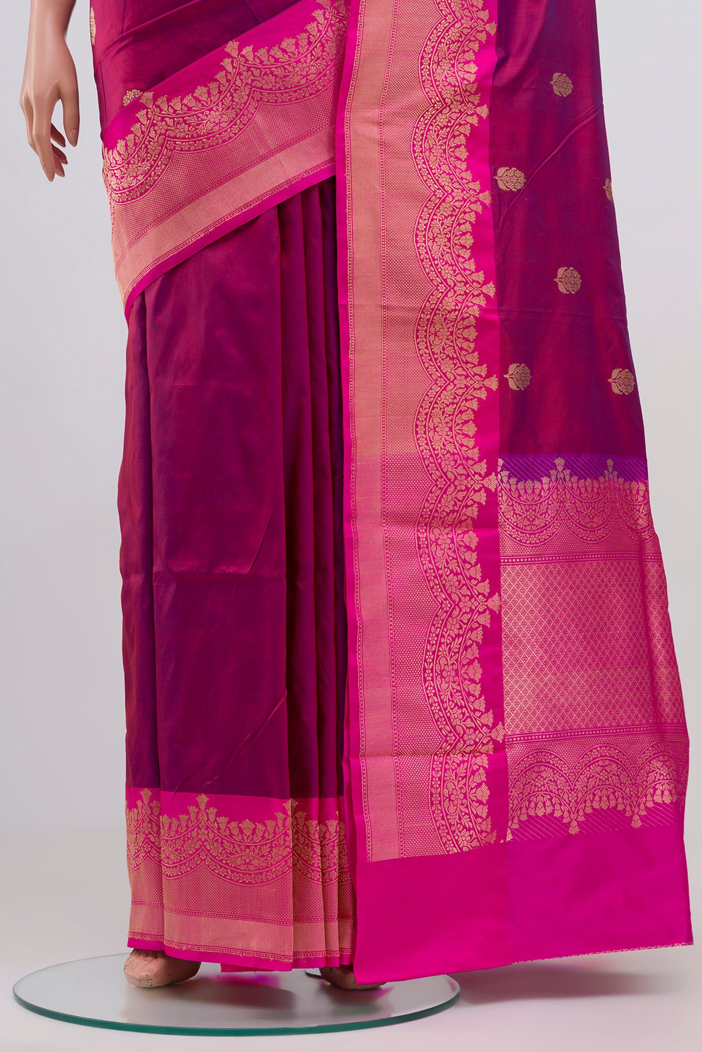 Pleats and pallu of Maroon Banarasi Katan Silk Saree with Zari Butta on the body and Zari Border. 