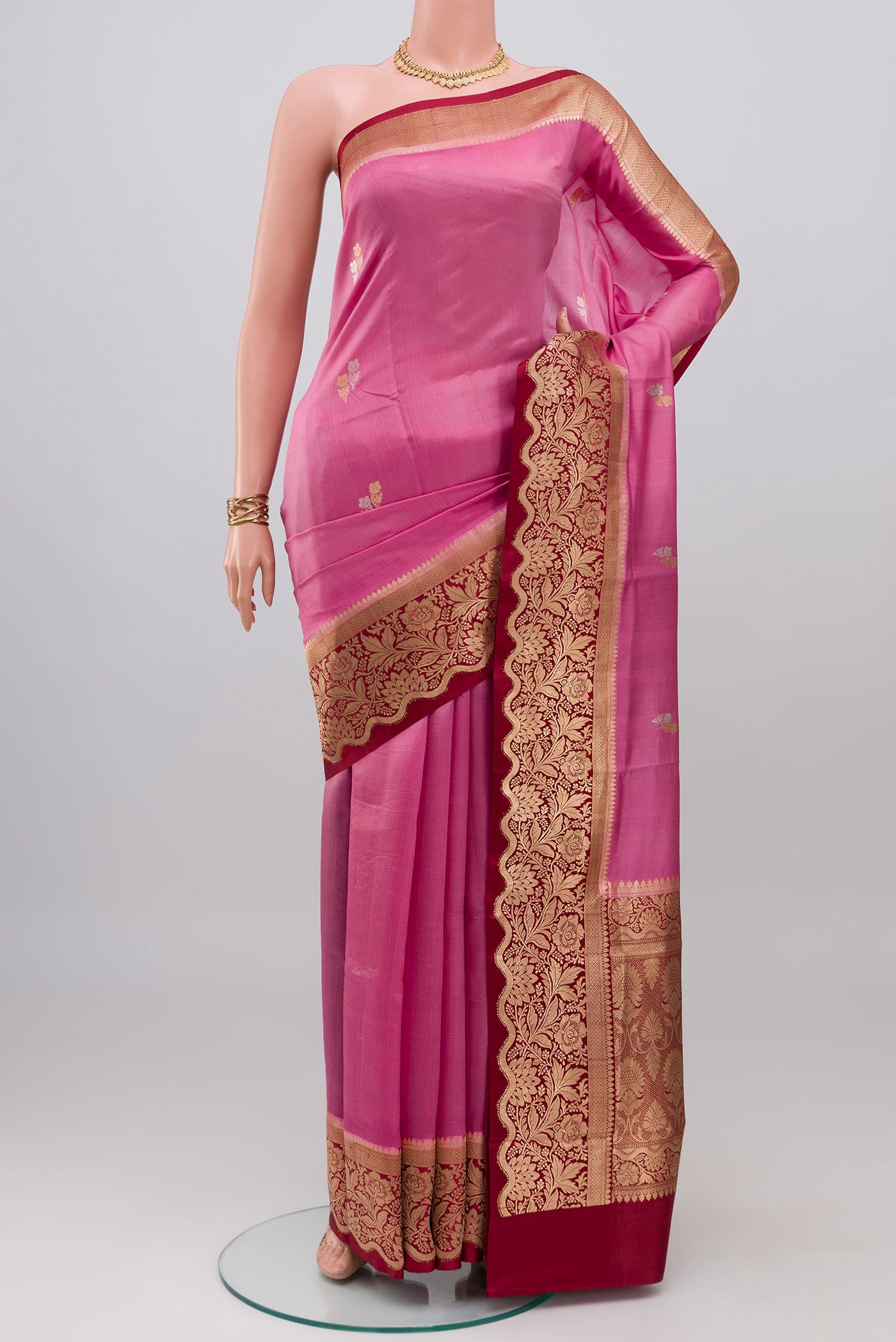 Pink Banarasi Katan Silk Saree with Zari Butta on the body and Zari Border.  displayed on a mannequin