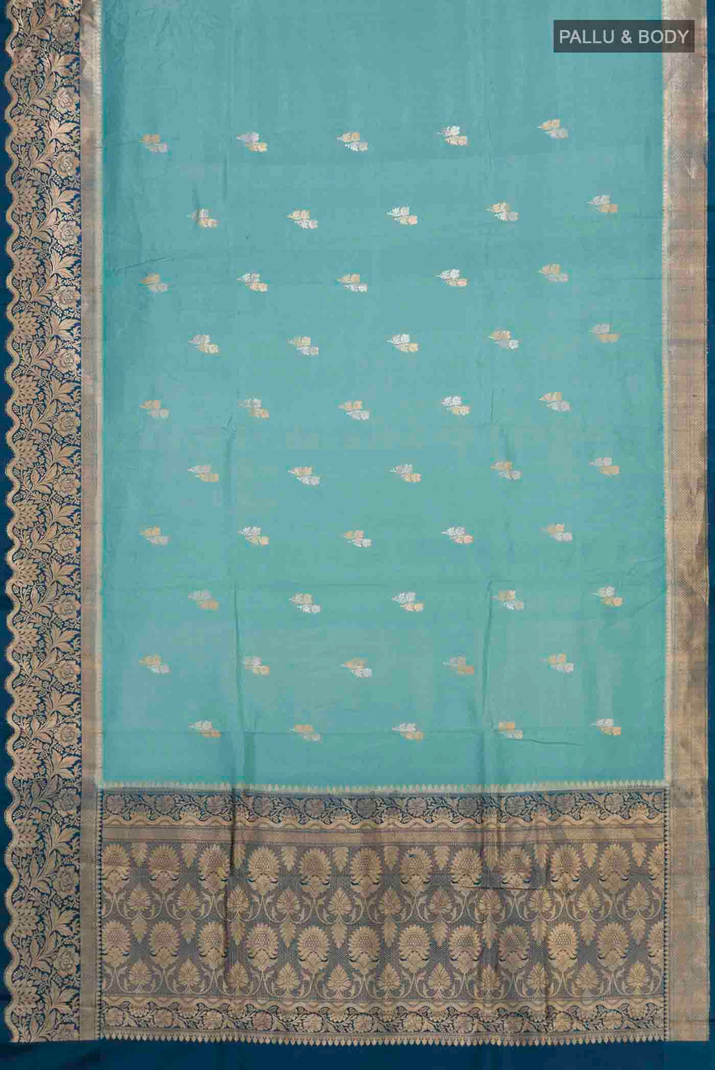 Flat view of Sky Blue Banarasi Katan Silk Saree with Zari Butta on the body and Zari Border. 
