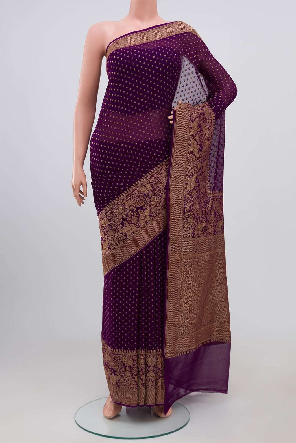 Purple Georgette Saree with Fancy on the body and Fancy Border.  displayed on a mannequin
