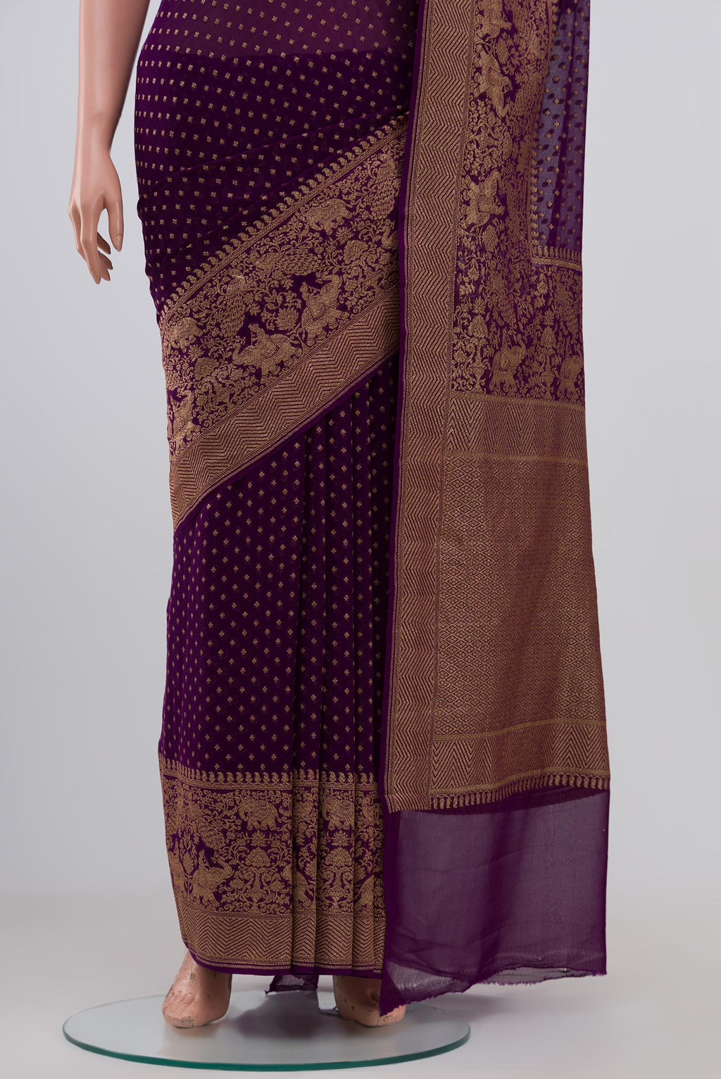 Pleats and pallu of Purple Georgette Saree with Fancy on the body and Fancy Border. 