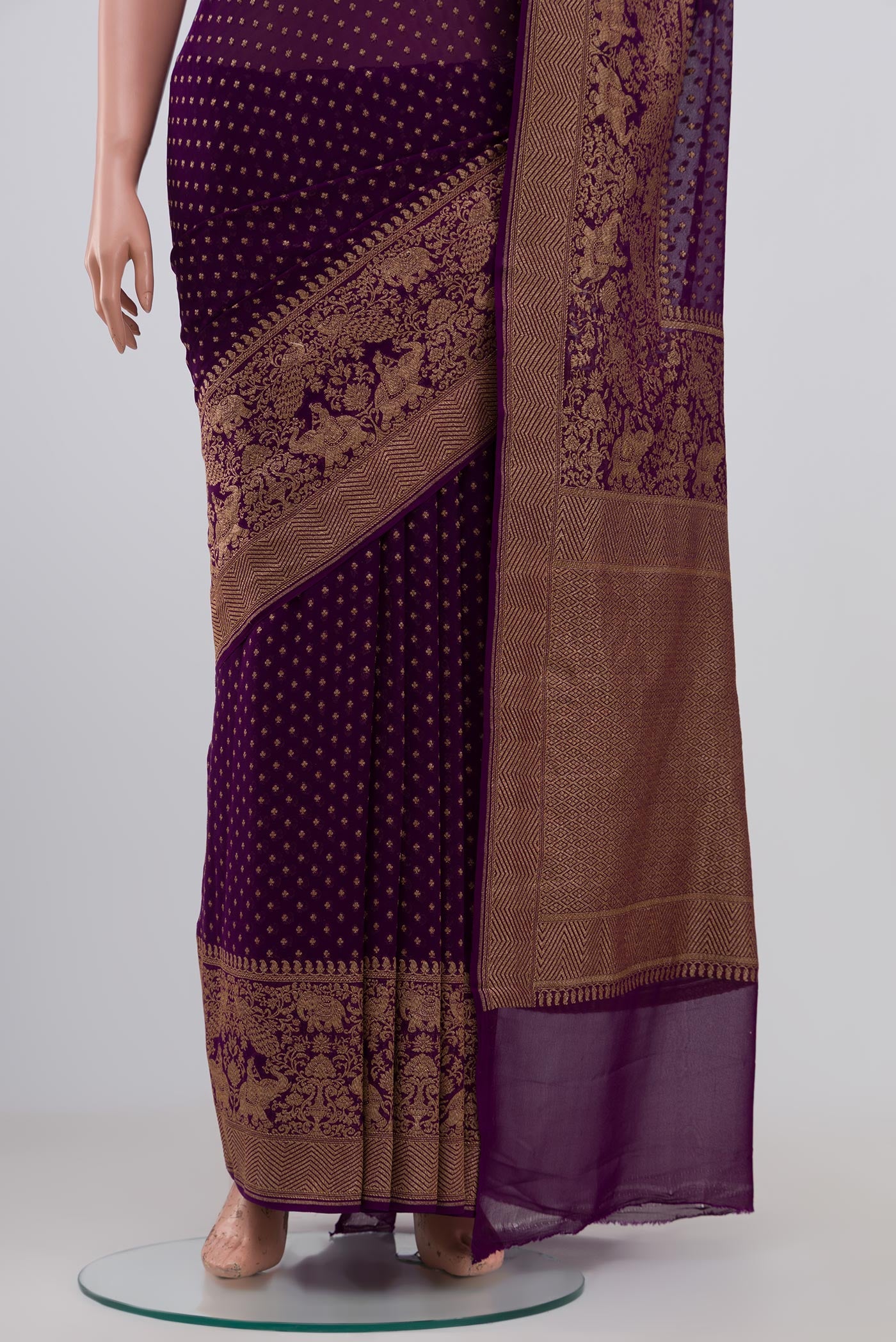 Pleats and pallu of Purple Georgette Saree with Fancy on the body and Fancy Border. 