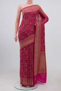 Pink Georgette Saree with Fancy on the body and Zari Border.  displayed on a mannequin