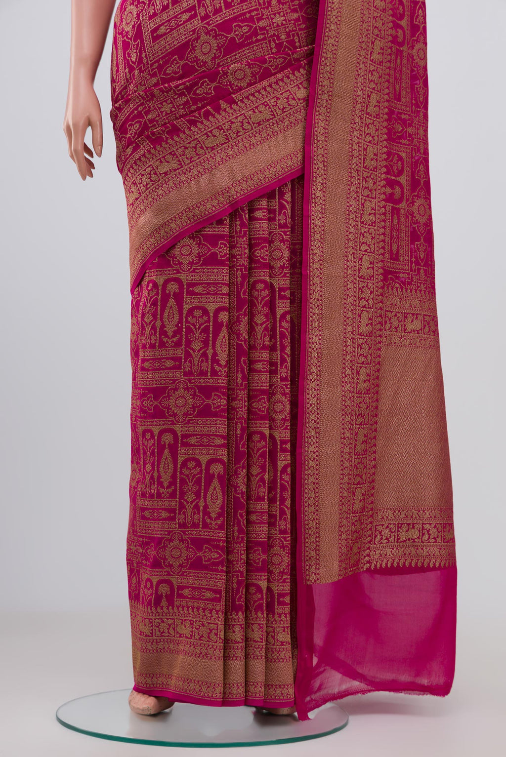 Pleats and pallu of Pink Georgette Saree with Fancy on the body and Zari Border. 