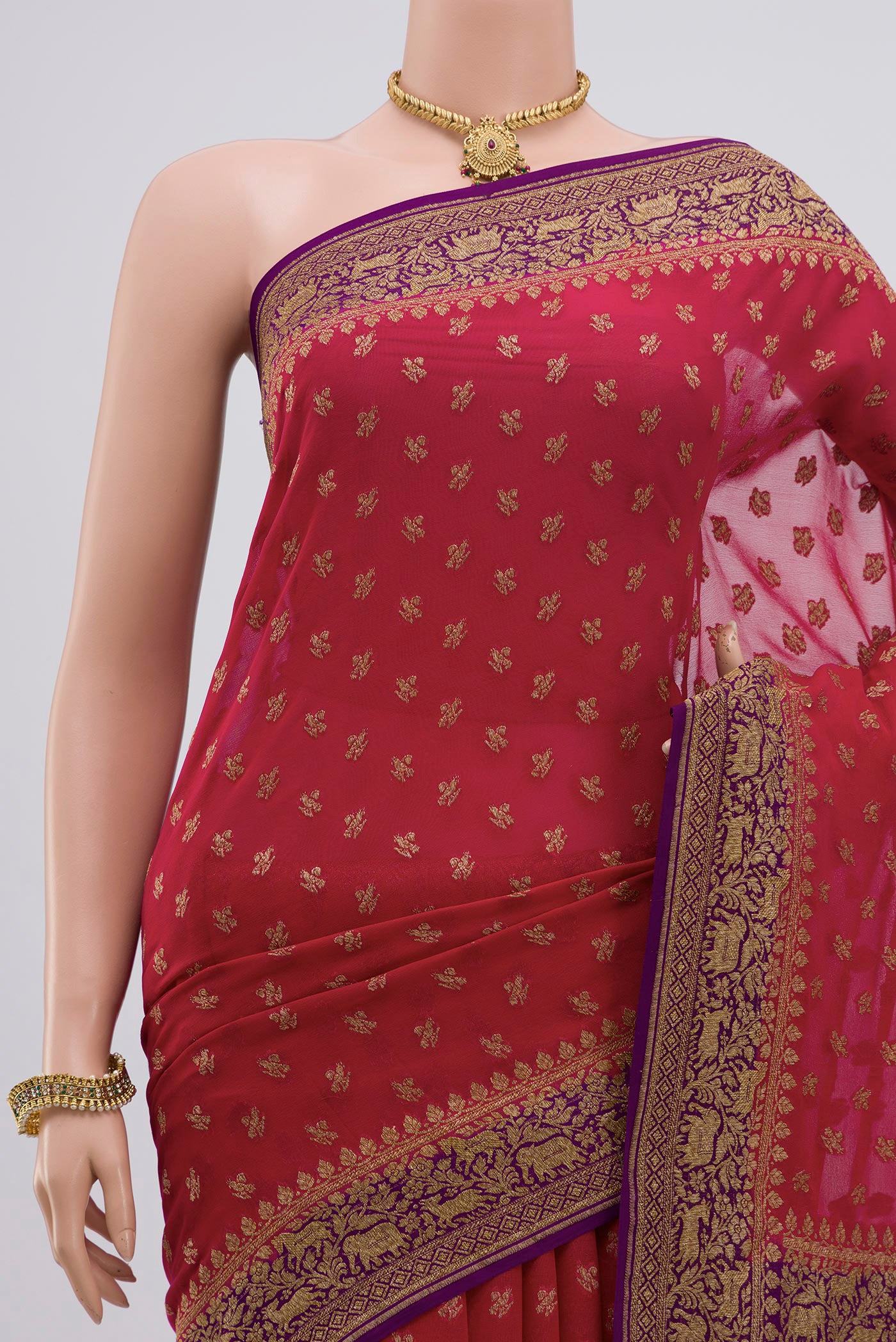 Border image of Red Georgette Saree with Fancy on the body and Zari Border. 