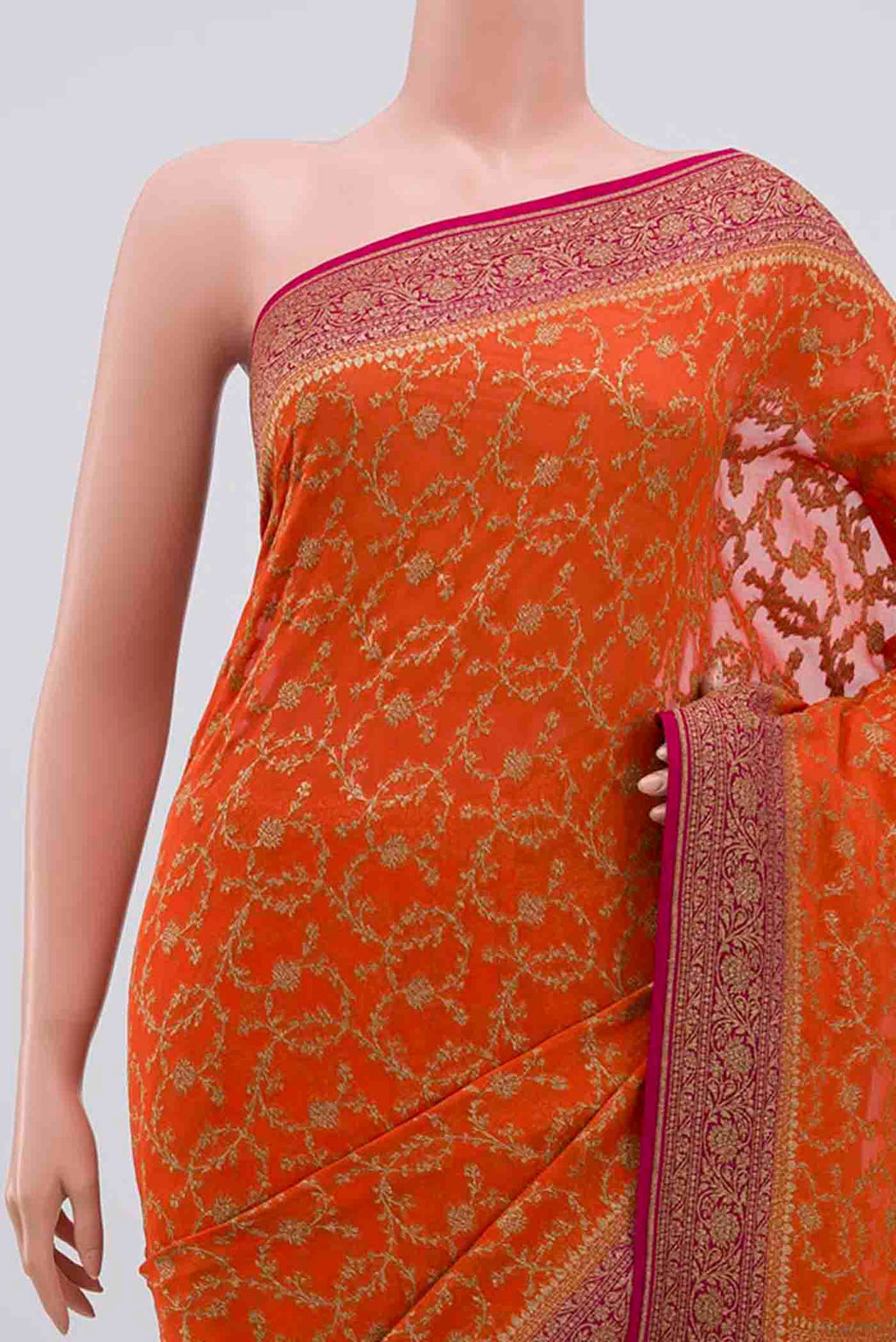 Border image of Orange Banarasi Georgette Saree with Zari Brocade on the body and Zari Border. 