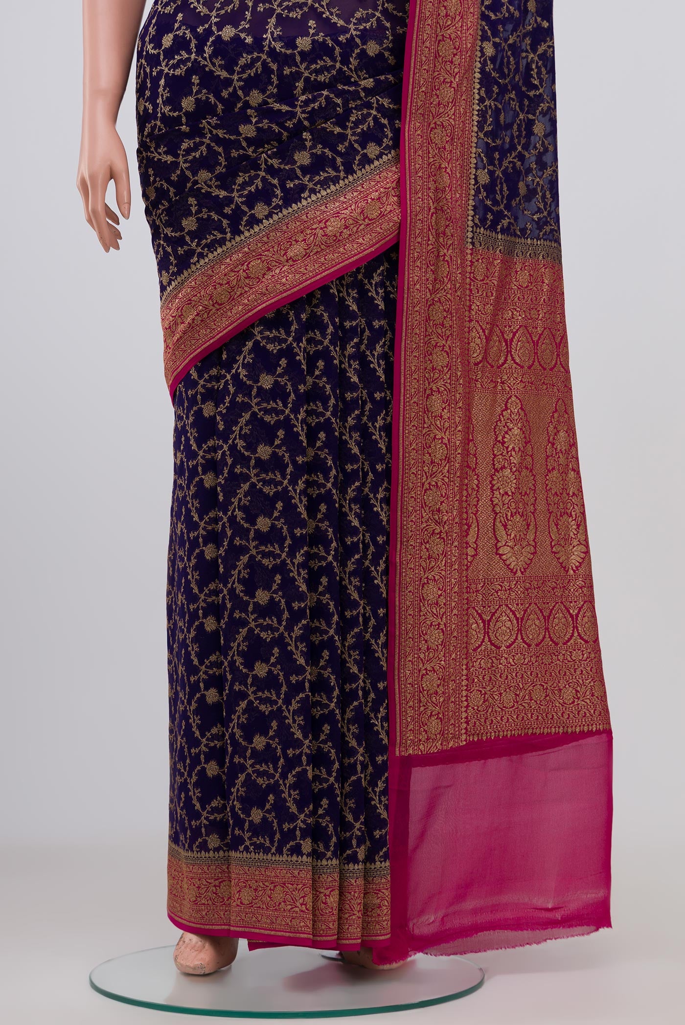 Pleats and pallu of Blue Georgette Saree with Fancy on the body and Zari Border. 