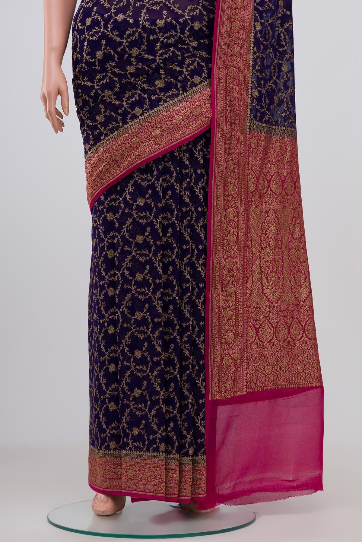 Pleats and pallu of Blue Georgette Saree with Fancy on the body and Zari Border. 