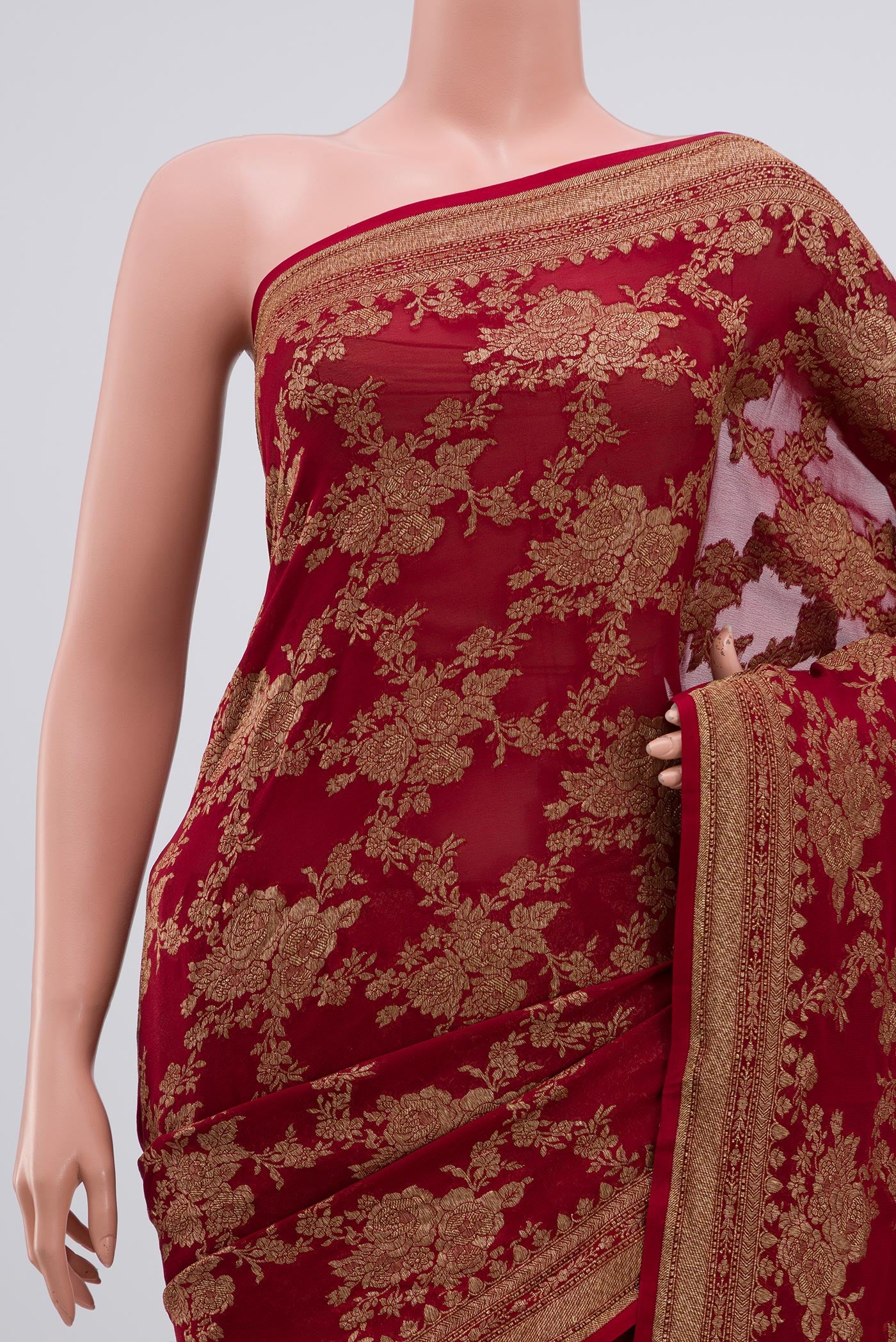Border image of Maroon Georgette Saree with Fancy on the body and Zari Border. 