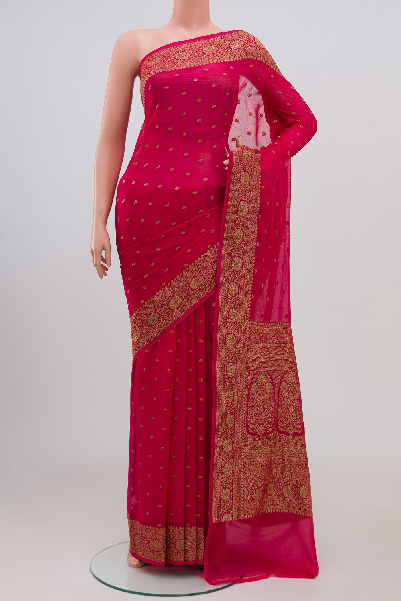Pink Banarasi Georgette Saree with Zari Butta on the body and Zari Border.  displayed on a mannequin