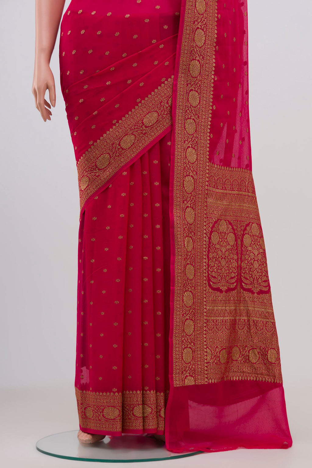 Pleats and pallu of Pink Banarasi Georgette Saree with Zari Butta on the body and Zari Border. 