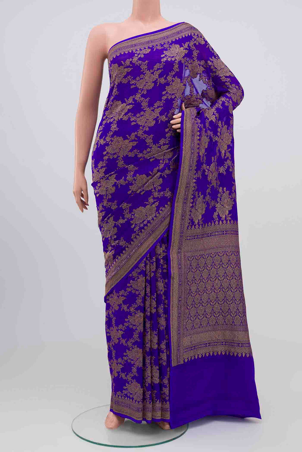 Royal Blue Banarasi Georgette Saree with Zari Brocade on the body and Zari Border.  displayed on a mannequin