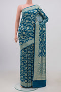 Blue Georgette Saree with Fancy on the body and Zari Border.  displayed on a mannequin