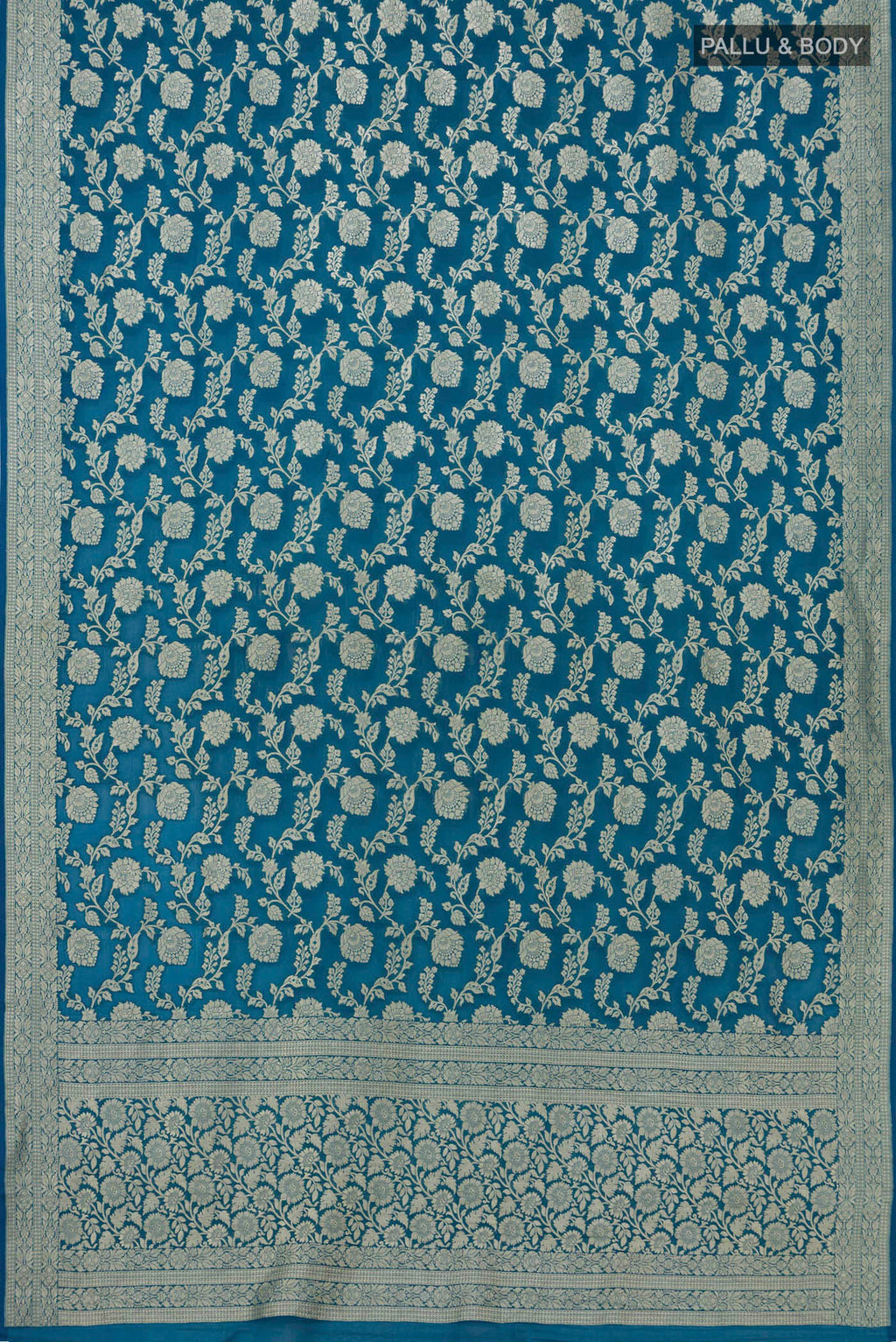 Flat view of Blue Georgette Saree with Fancy on the body and Zari Border. 