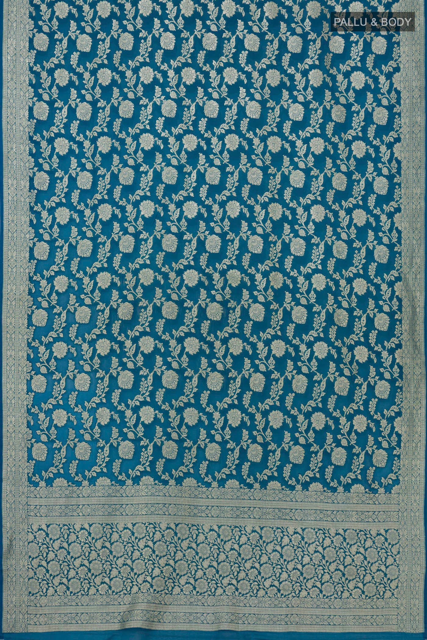 Flat view of Blue Georgette Saree with Fancy on the body and Zari Border. 