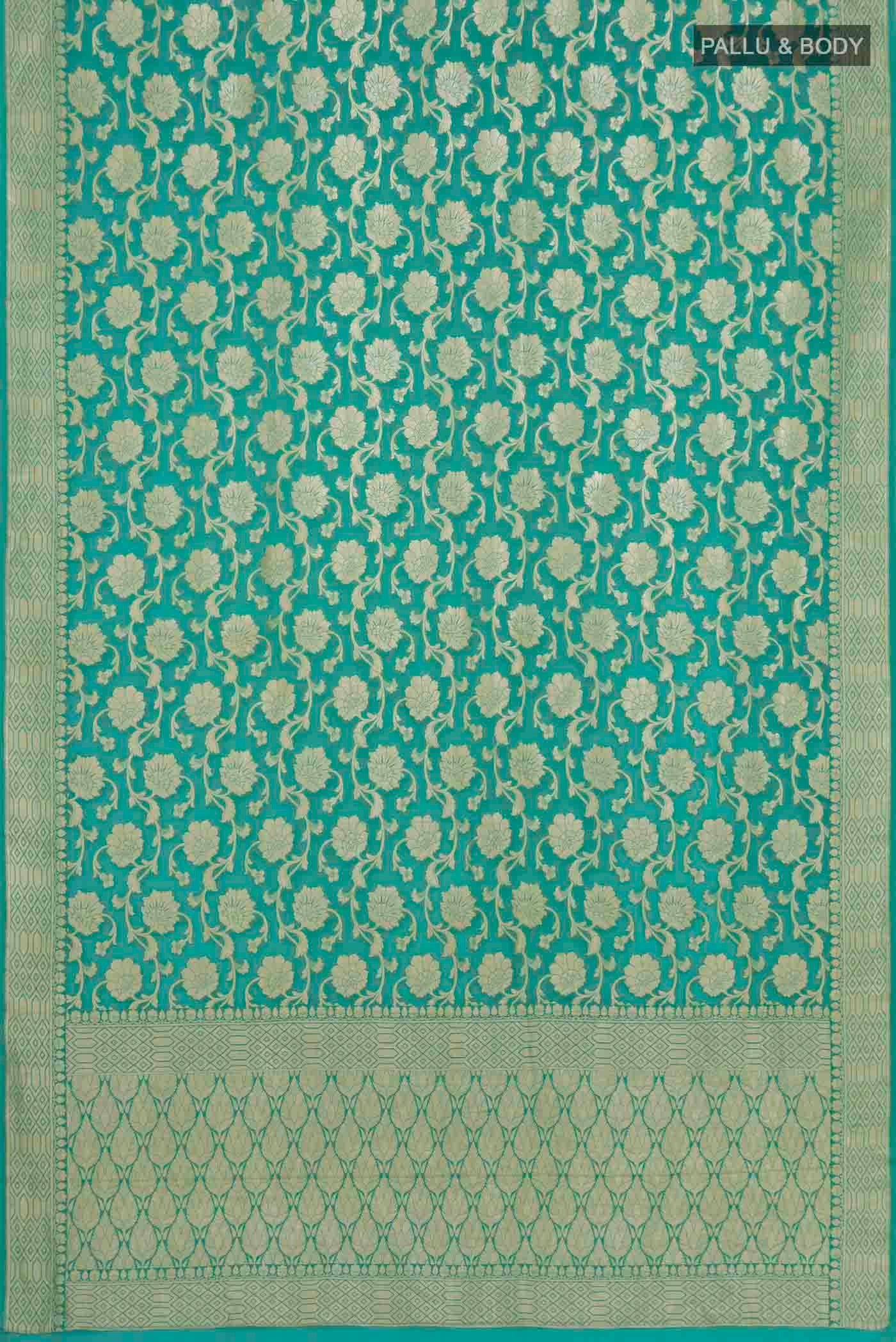 Flat view of Mint Green Banarasi Georgette Saree with Zari Brocade on the body and Zari Border. 