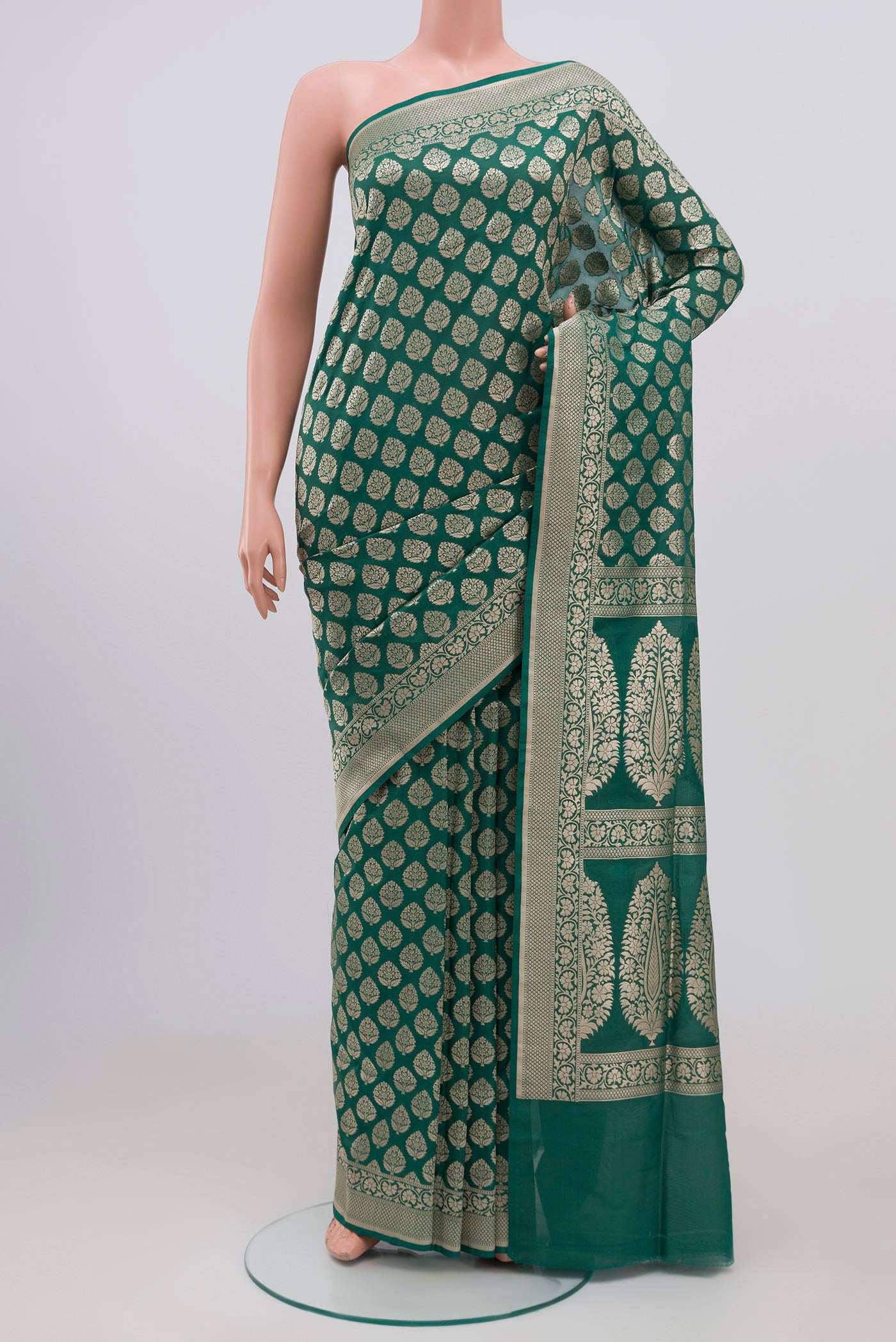 Green Banarasi Silk Saree with Zari Brocade on the body and Zari Border.  displayed on a mannequin