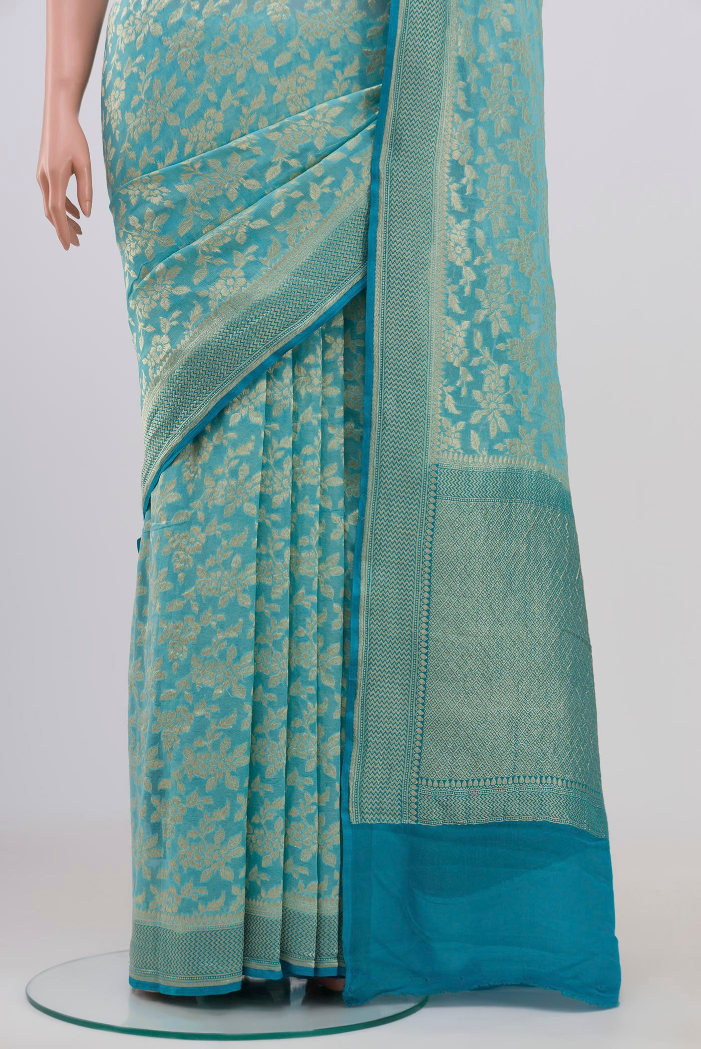 Pleats and pallu of Sky Blue Banarasi Georgette Saree with Fancy on the body and Zari Border. 