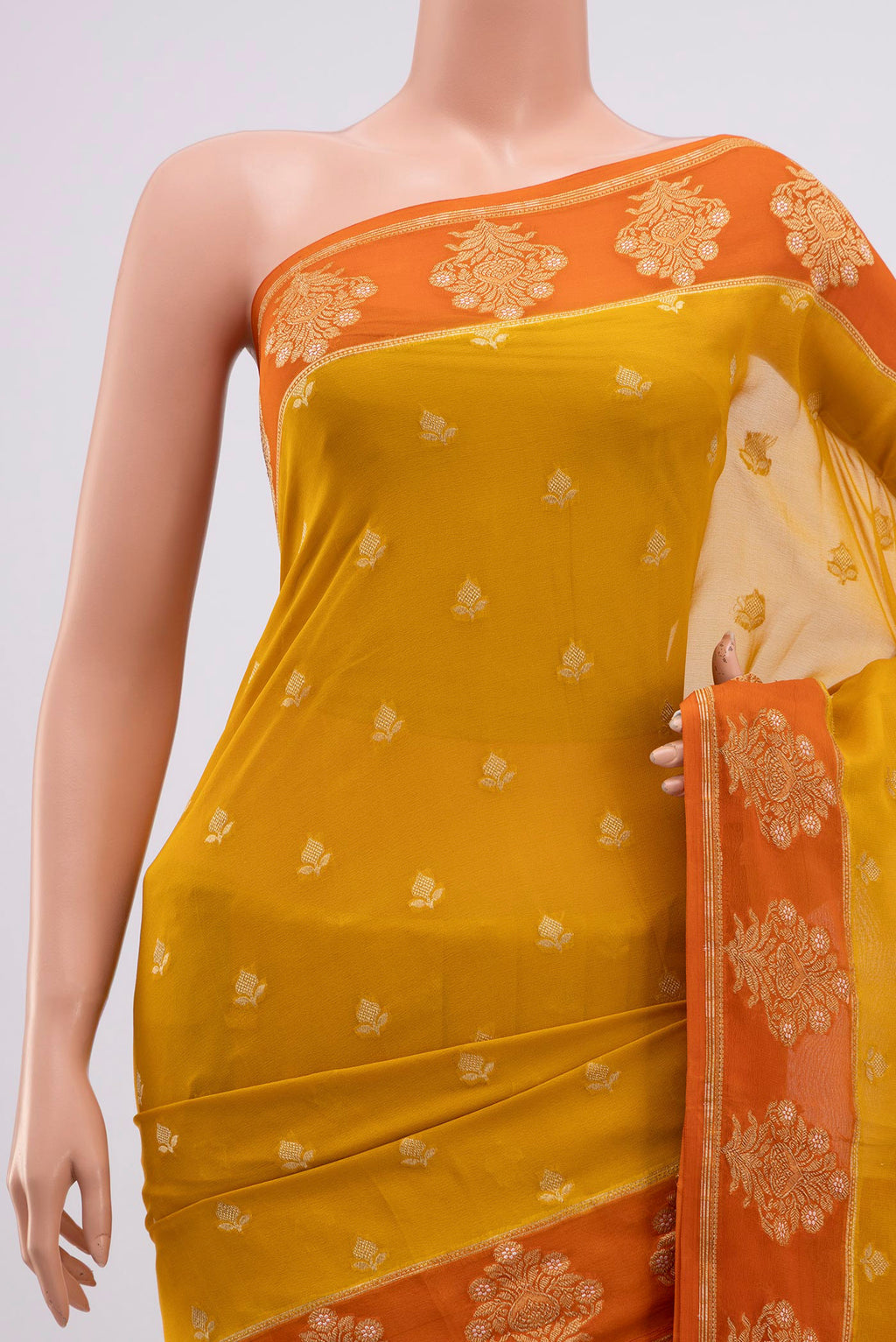 Border image of Yellow Banarasi Georgette Saree with Zari Butta on the body and Fancy Border. 