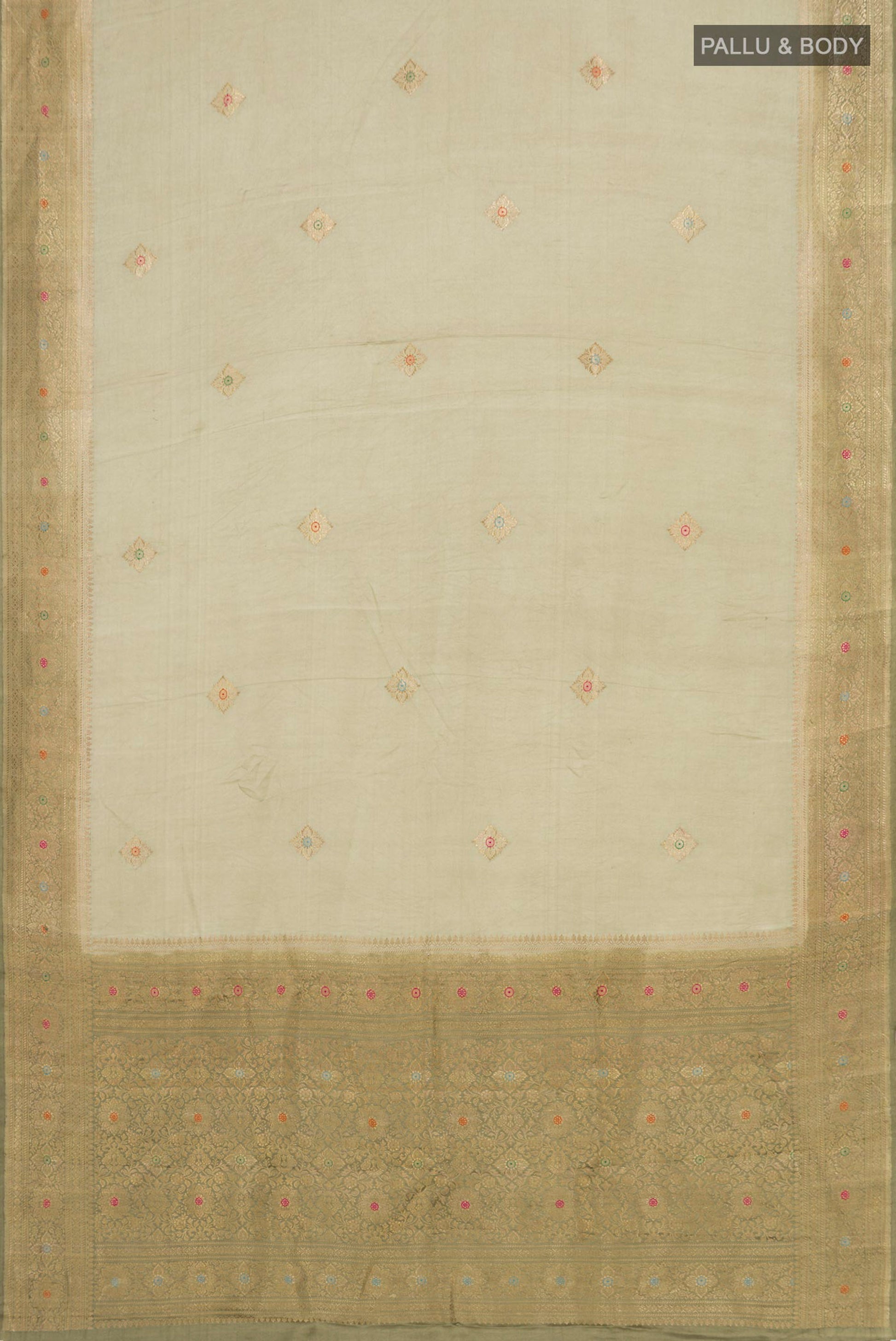 Flat view of Pista Green Banarasi Silk Saree with Zari Butta on the body and Zari Border. 