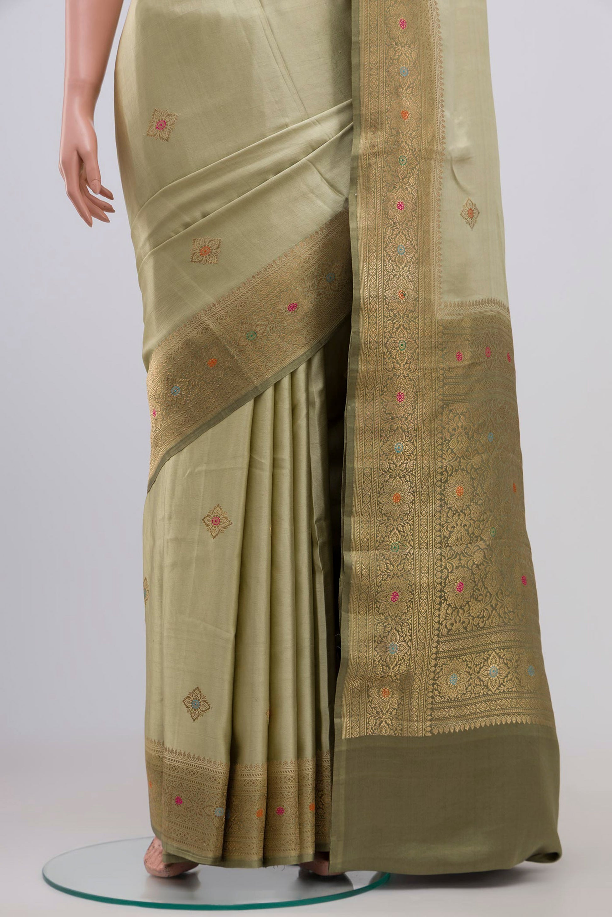 Pleats and pallu of Pista Green Banarasi Silk Saree with Zari Butta on the body and Zari Border. 