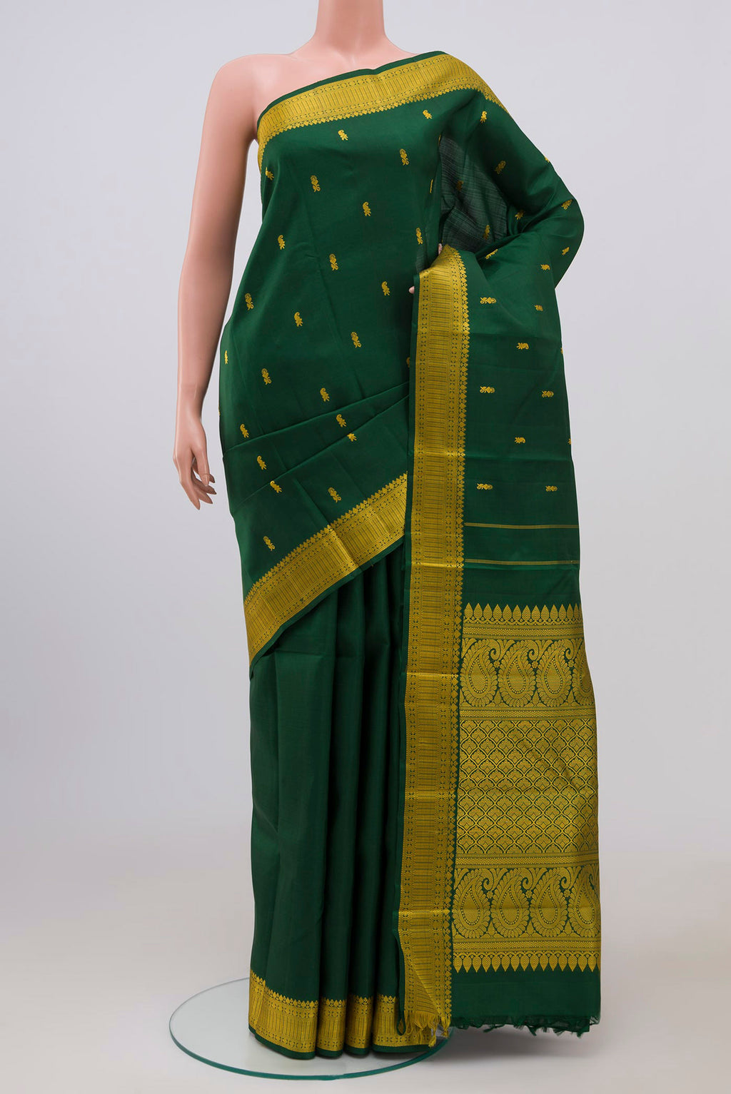 Bottle Green Kanchipuram Silk Saree with Thread Butta on the body and Thread Border.  displayed on a mannequin