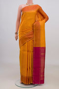 Pure Silk Yellow Kanchipuram Saree with Checked design on the body and Plain Border.  displayed on a mannequin