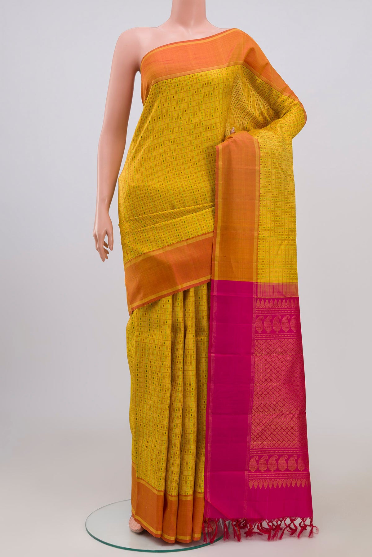 Pure Silk Pure Zari Yellow Kanchipuram Saree with Checked design on the body and Thin Zari Line.  displayed on a mannequin