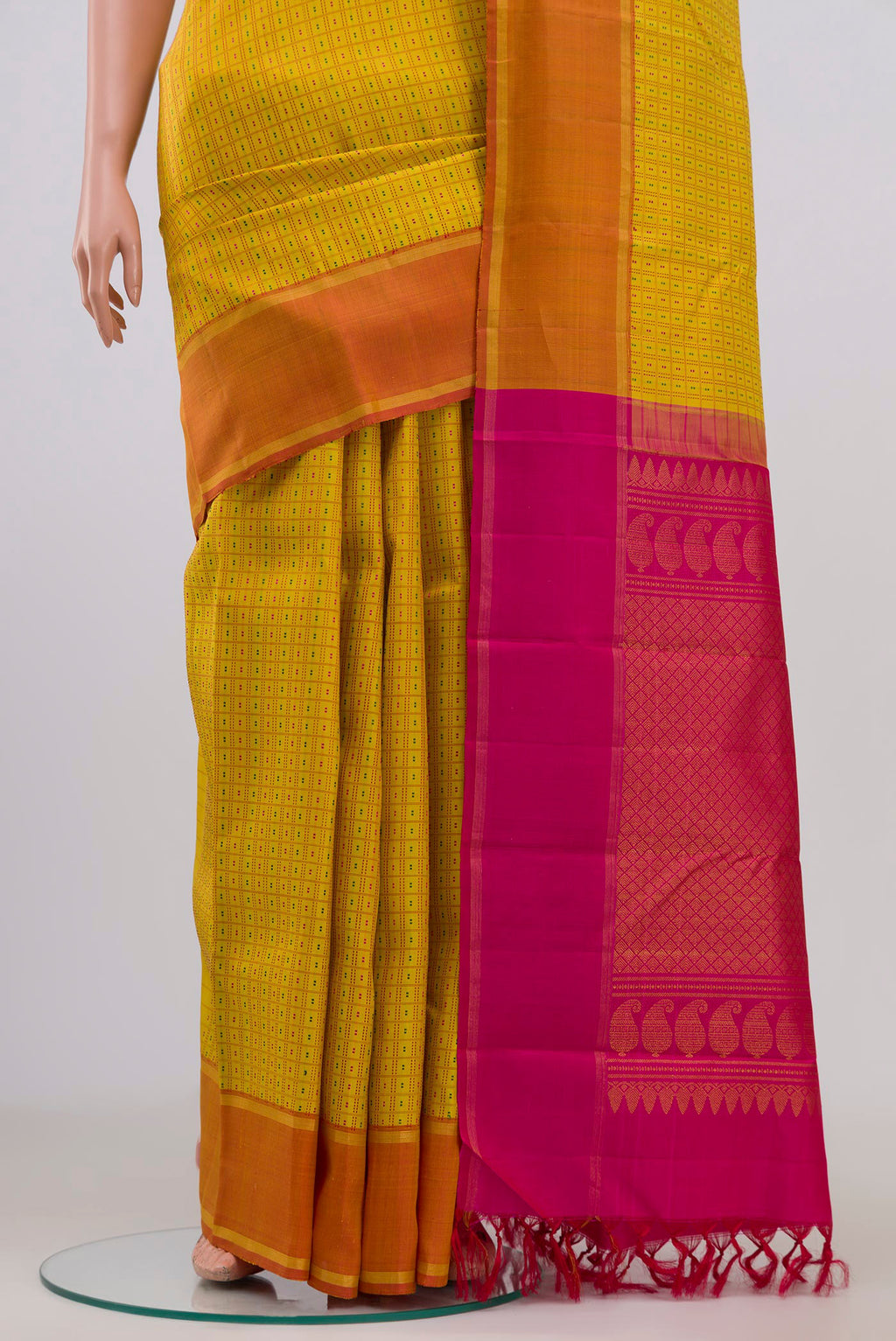 Pleats and pallu of Pure Silk Pure Zari Yellow Kanchipuram Saree with Checked design on the body and Thin Zari Line. 