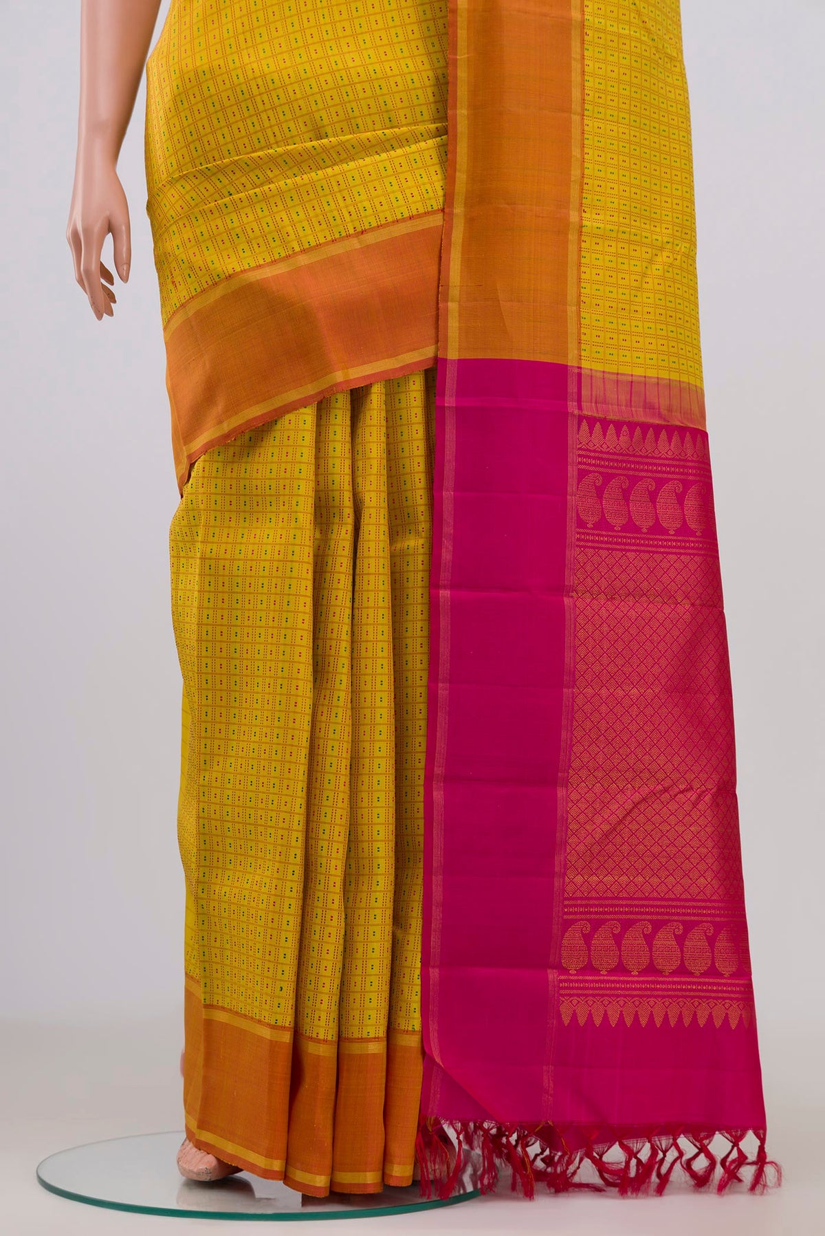 Pleats and pallu of Pure Silk Pure Zari Yellow Kanchipuram Saree with Checked design on the body and Thin Zari Line. 