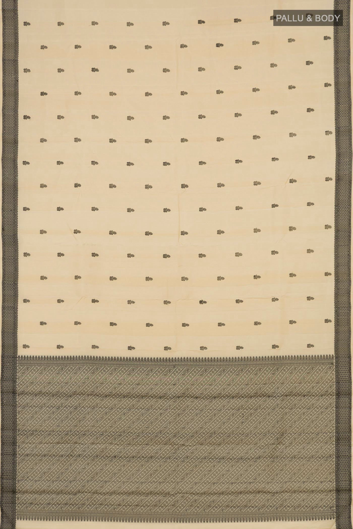 Flat view of Cream Kanchipuram Saree with Thread Butta on the body and Thread Border. 