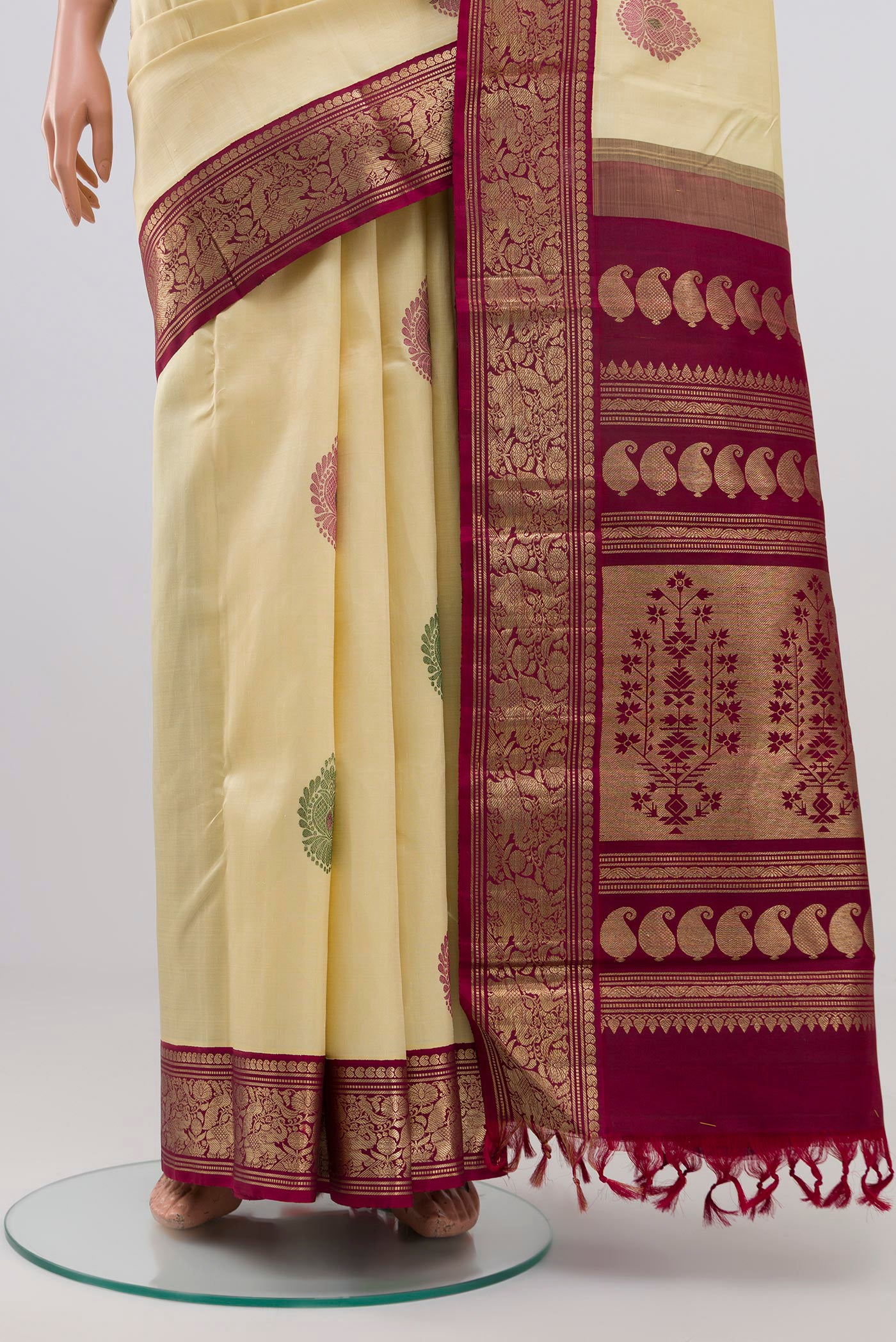 Pleats and pallu of Pure Silk Pure Zari Cream Kanjivaram Saree with Zari Butta on the body and Zari Border. 
