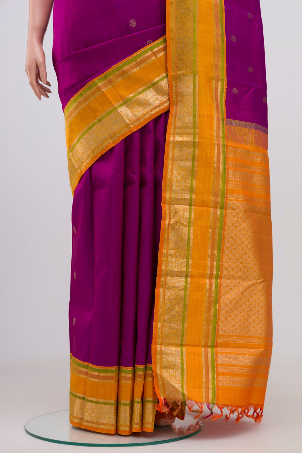 Pleats and pallu of Magenta Kanjivaram Silk Saree with Zari Butta on the body and Zari Border. 