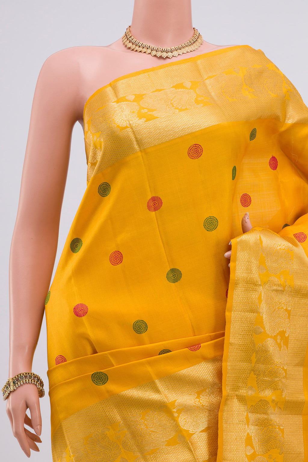 Border image of Yellow Kanjivaram Silk Saree with Thread Butta on the body and Zari Border. 