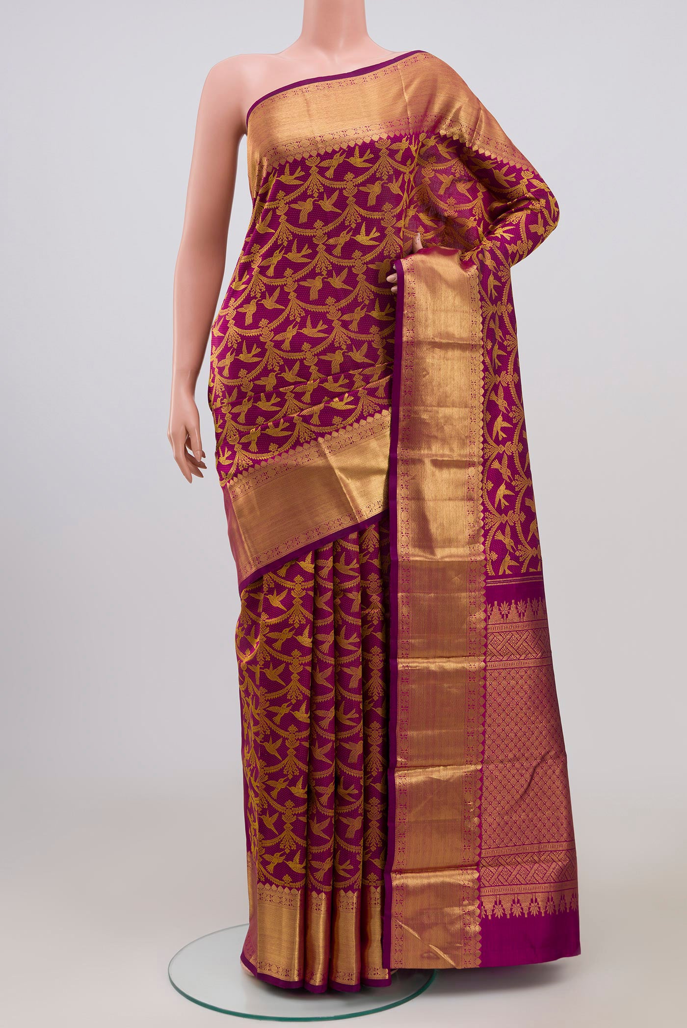 Pure Silk Pure Zari Purple Kanjivaram Saree with Jacquard design on the body and Zari Border.  displayed on a mannequin