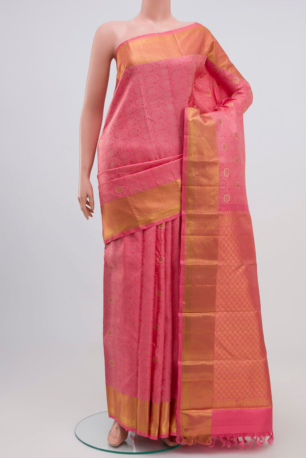 Peach Kanjivaram Silk Saree with Jacquard With Zari Butta on the body and Zari Border.  displayed on a mannequin
