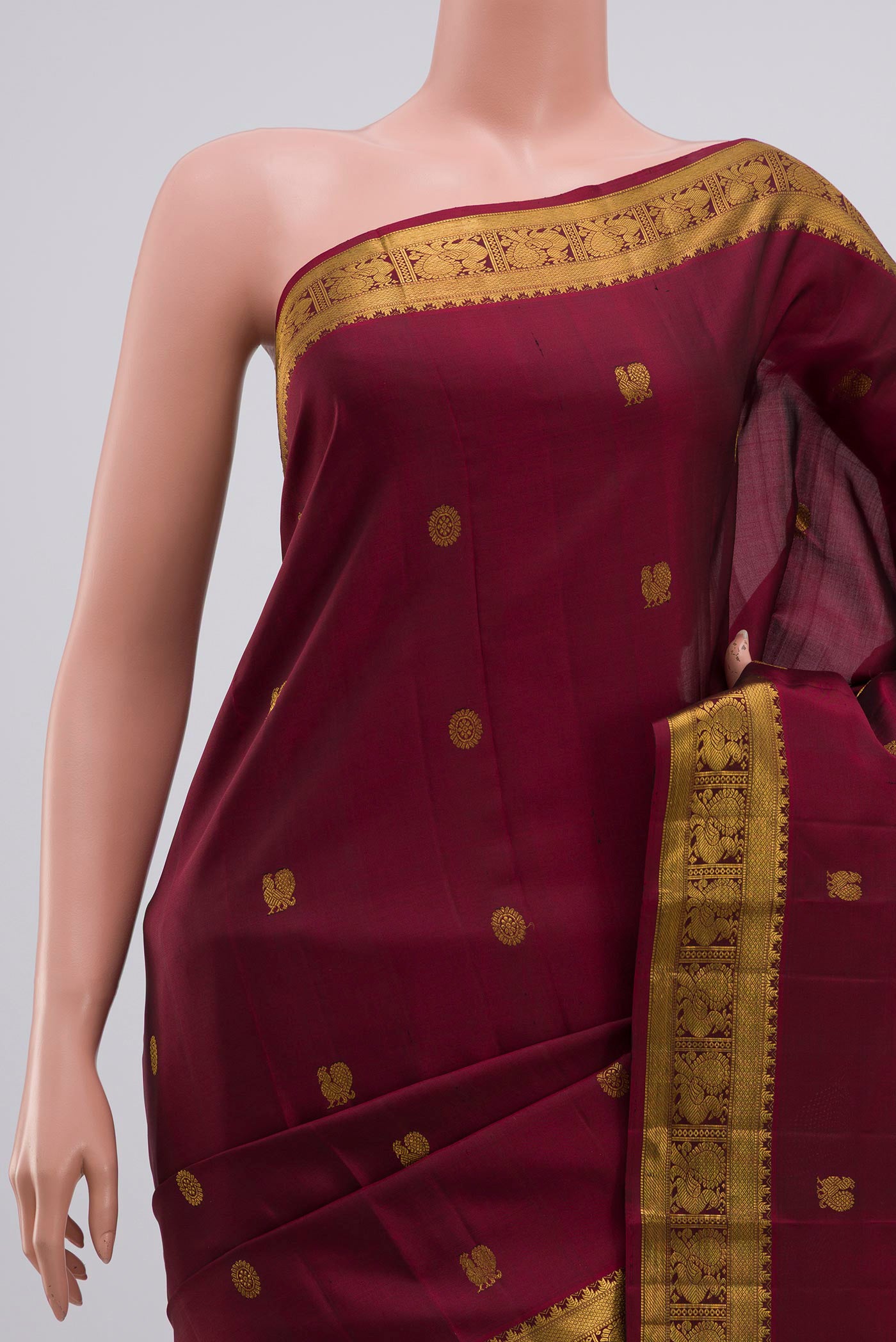 Border image of Maroon Kanjivaram Silk Saree with Zari Butta on the body and Zari Border. 
