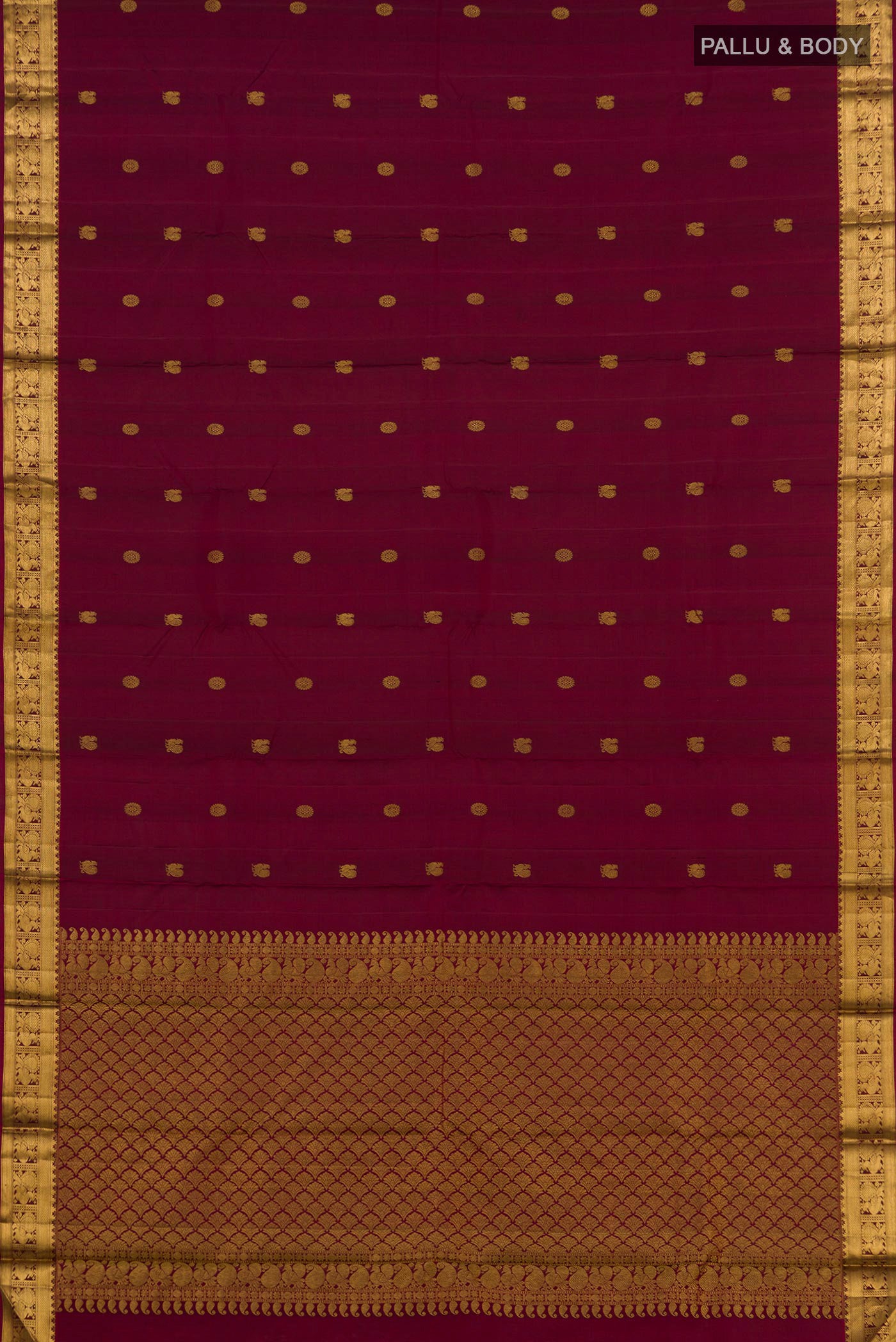 Flat view of Maroon Kanjivaram Silk Saree with Zari Butta on the body and Zari Border. 