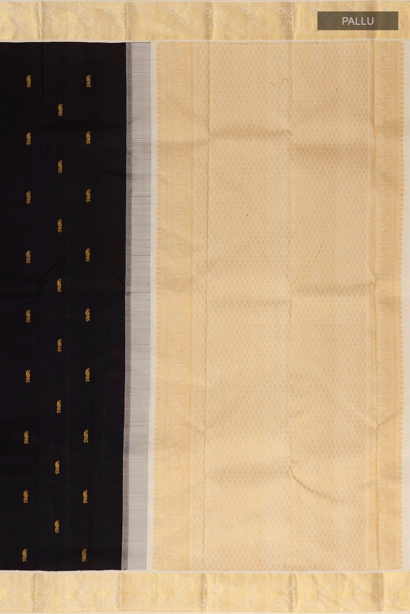 Close up image of the pallu of Black Kanjivaram Saree with Zari Butta on the body and Zari Border. 