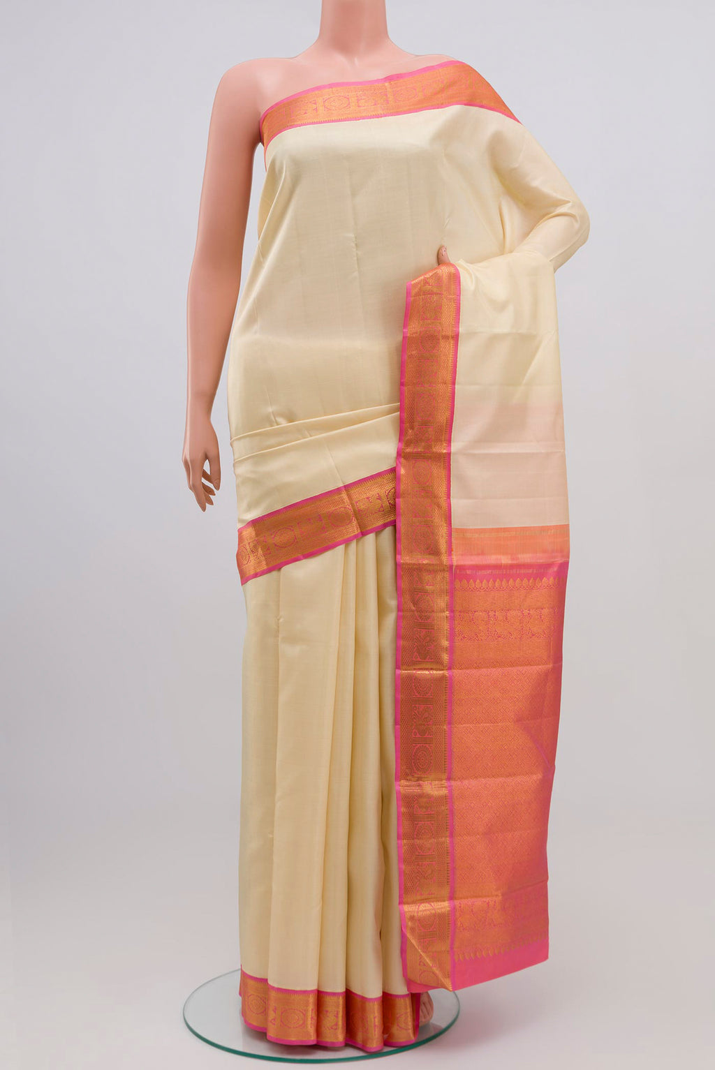 Pure Silk Pure Zari Cream Kanjivaram Saree with Plain Body and Zari Border.  displayed on a mannequin