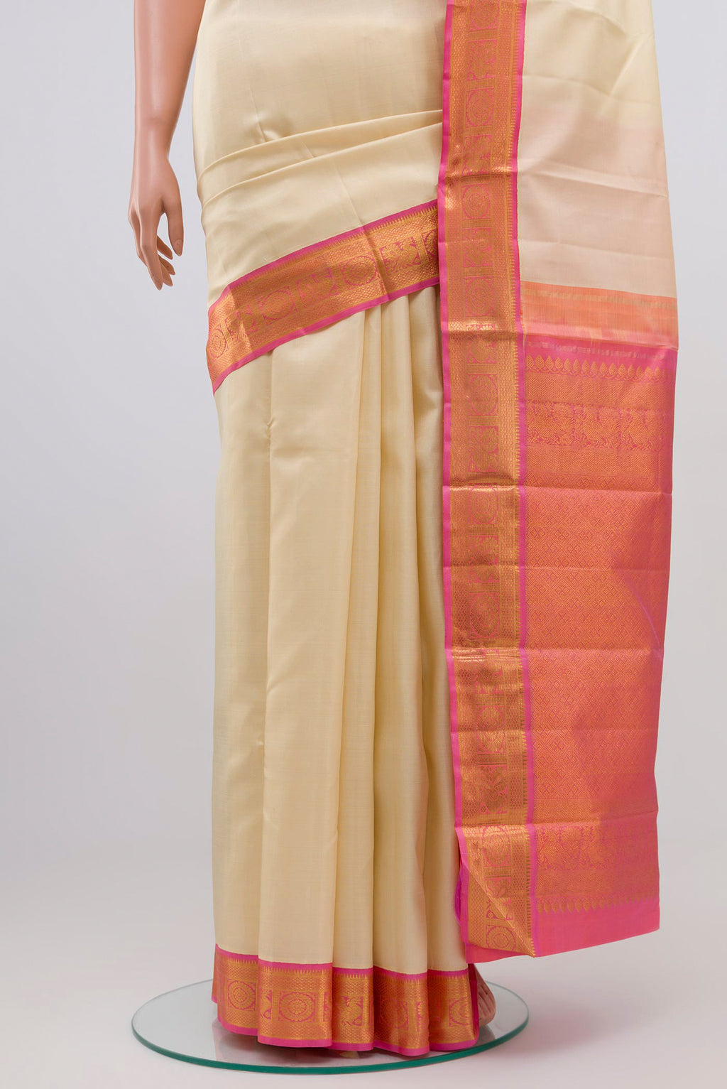 Pleats and pallu of Pure Silk Pure Zari Cream Kanjivaram Saree with Plain Body and Zari Border. 
