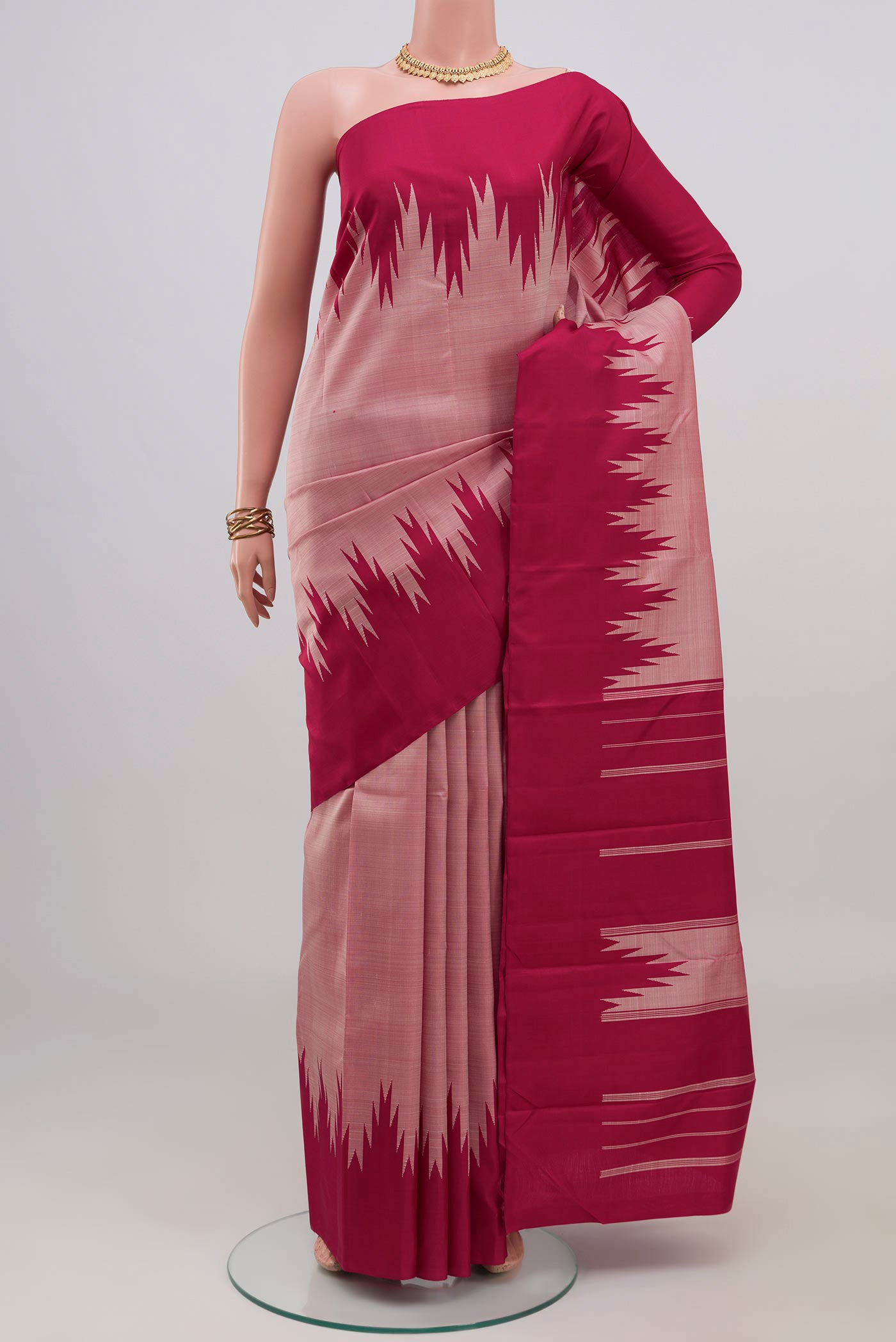 Rose Gold Kanchipuram Silk Saree with Plain Body and Temple Border.  displayed on a mannequin