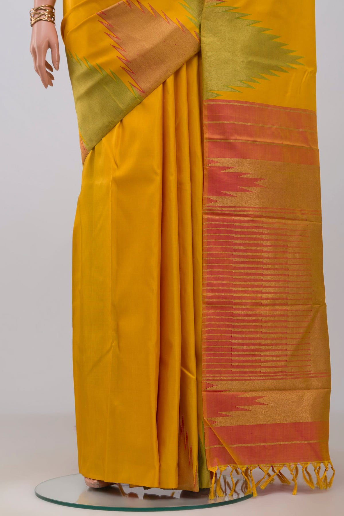 Pleats and pallu of Pure Silk Pure Zari Yellow Kanjivaram Saree with Plain Body and Temple Border. 